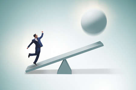 Career progression concept with businessman and seesawの写真素材