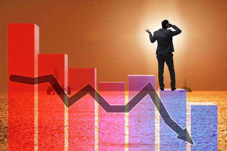 Crisis in the oil industry with businessmanの写真素材