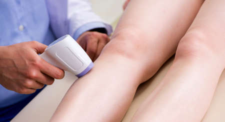 The young woman visiting doctor dermatologist