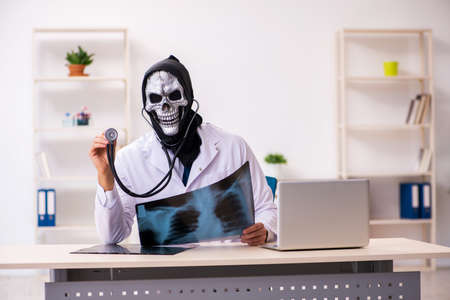 Male devil doctor radiologist working in the clinic