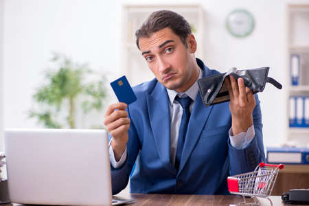 Young male businessman in ecommerce concept