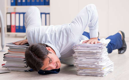 Extremely busy employee working in the office