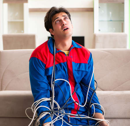 Electrician contractor with tangled cables