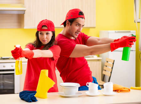 Cleaning professional contractors working at kitchen
