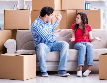 Young pair moving in to new house with boxes