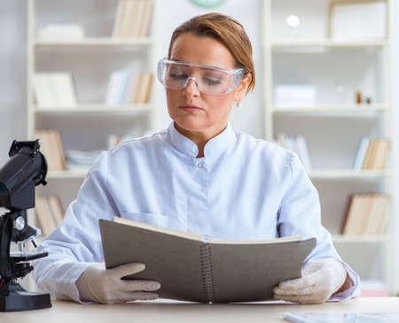 Woman chemist working in hospital clinic labの写真素材