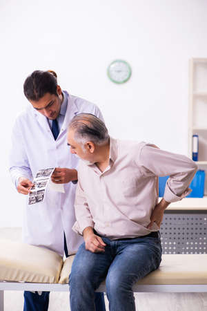 Old patient visiting young male doctor