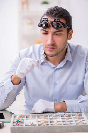 Young male jeweler at workshop