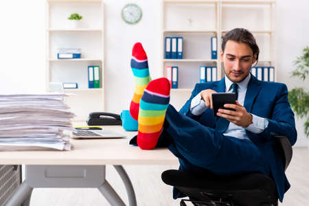 Young male businessman working in the officeの写真素材