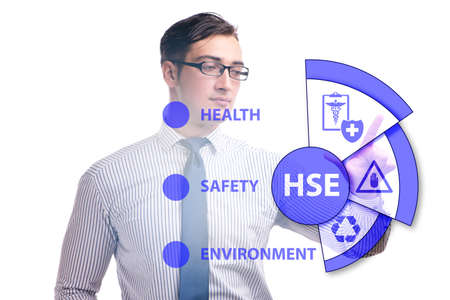 HSE concept with businessman pressing virtual buttonの写真素材