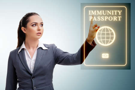 Concept of immunity passport - pressing virtual buttonの写真素材