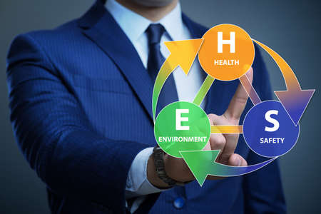 HSE concept with the businessman pressing virtual buttonの写真素材
