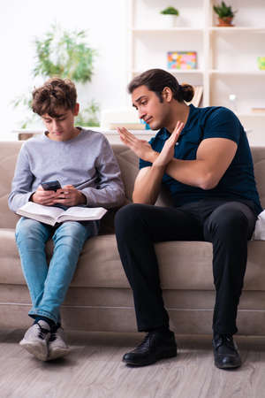 Father and son in exam preparation conceptの写真素材