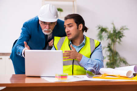 Two male architects working in the office