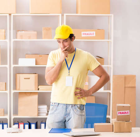 Handsome contractor working in box delivery relocation service