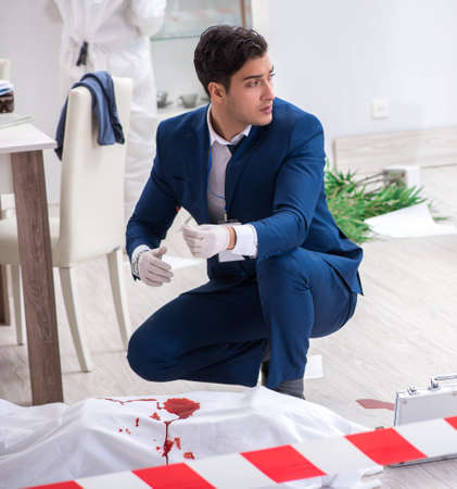 Forensics investigator at the scene of office crimeの写真素材