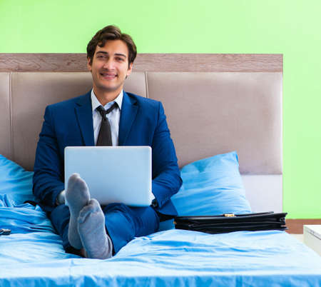 Businessman working in the hotel roomの写真素材