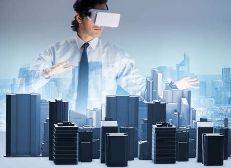 The man with virtual reality goggles doing urban planning