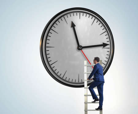 Businessman in time management conceptの写真素材