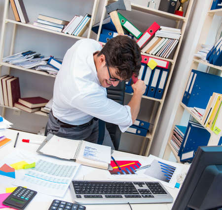 The busy frustrated businessman angry in the officeの写真素材