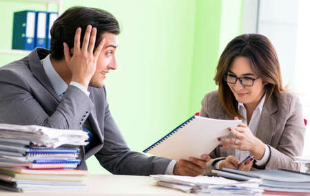 Two colleagues working in the officeの写真素材