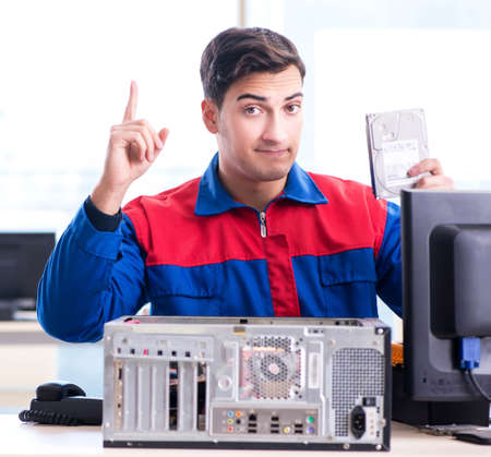 Data restoration specialist repairing corrupt hard driveの写真素材