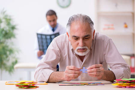 Doctor and patient suffering from Alzheimer disease