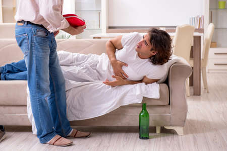 Man with drinking problem and the familyの写真素材