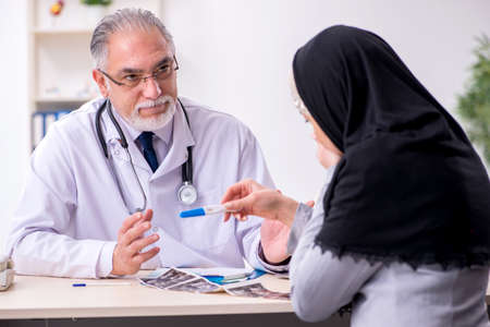 Arab woman visiting experienced doctorの写真素材