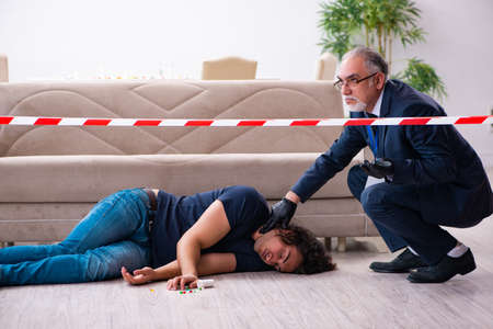 Old male forensic expert at crime scene