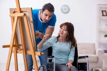 Disabled wife and young husband at home