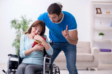Disabled wife and young husband at home