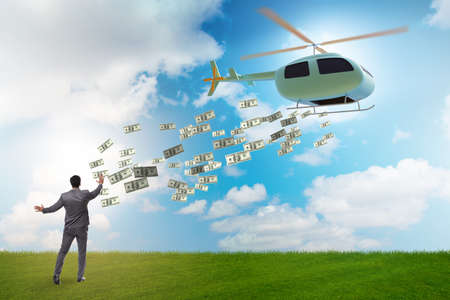 Helicopter money concept with businessmanの写真素材