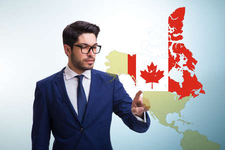 Concept of immigration to Canada with virtual button pressingの写真素材