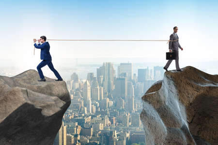 Boss holding his employee in retention conceptの写真素材