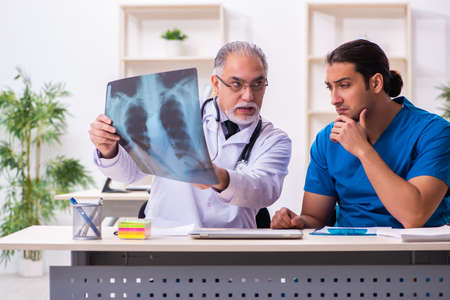 Two male doctors working in the clinicの写真素材