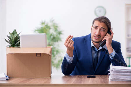Young man being fired from his workの写真素材
