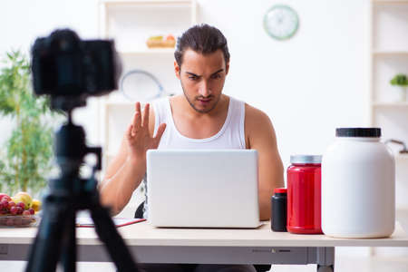 Young male blogger in dieting conceptの写真素材