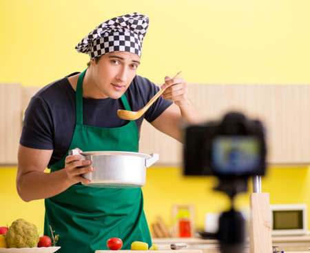 Young chef blogger explaining food preparationの写真素材