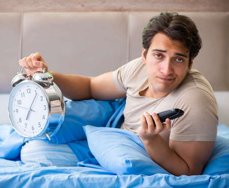 Man having trouble with his sleepの写真素材
