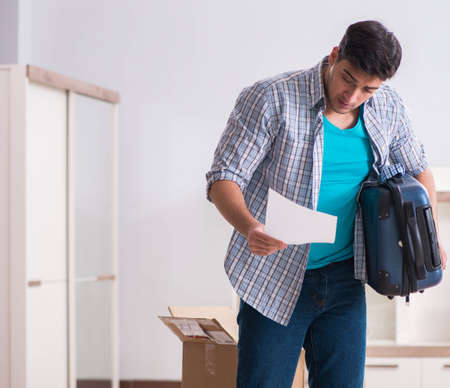 Unemployed man receiving foreclosure notice letterの写真素材