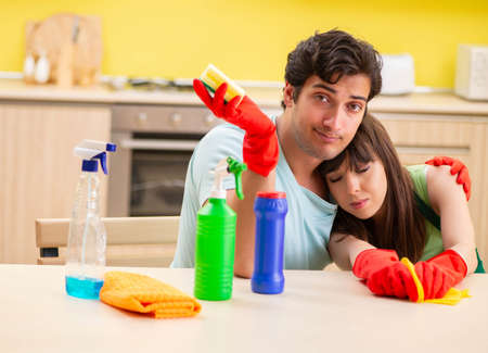 Young couple working at kitchen