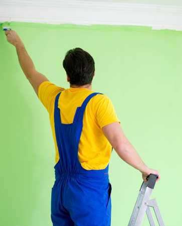 Young painter doing renovation at homeの写真素材