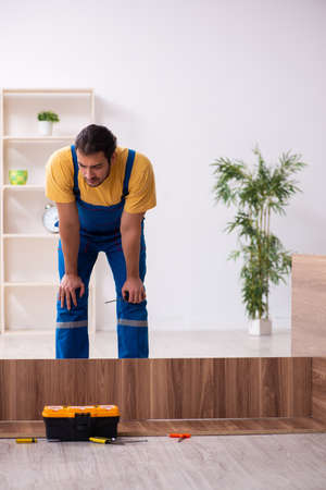 Young male carpenter working indoorsの写真素材