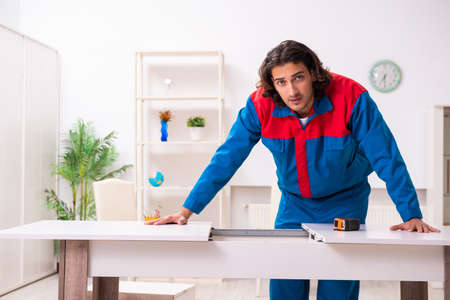Young male carpenter working indoorsの写真素材