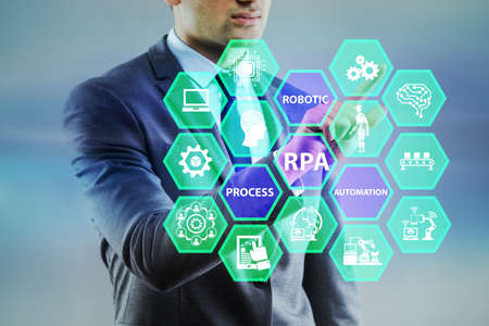 Businessman pressing buttons in RPA conceptの写真素材
