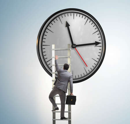 Businessman in time management conceptの写真素材