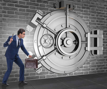 Man with gun stealing money from bankの写真素材