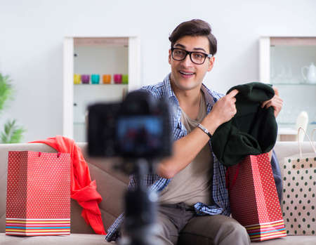 Male fashion blogger recording video for vlogの写真素材