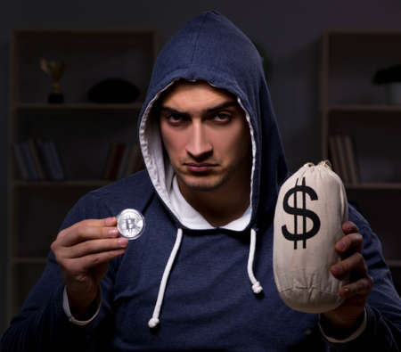 Young man in bitcoin mining conceptの写真素材